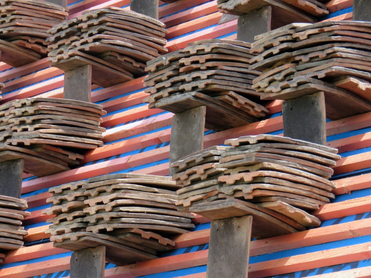 Tiles,stacked,on,a,roof,ready,for,fitting